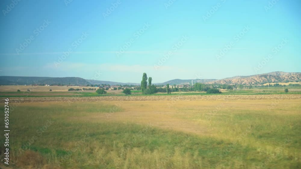 Fields and Hills from the Window of a Speeding Train
Fields and Hills from the Window of a Speeding Train