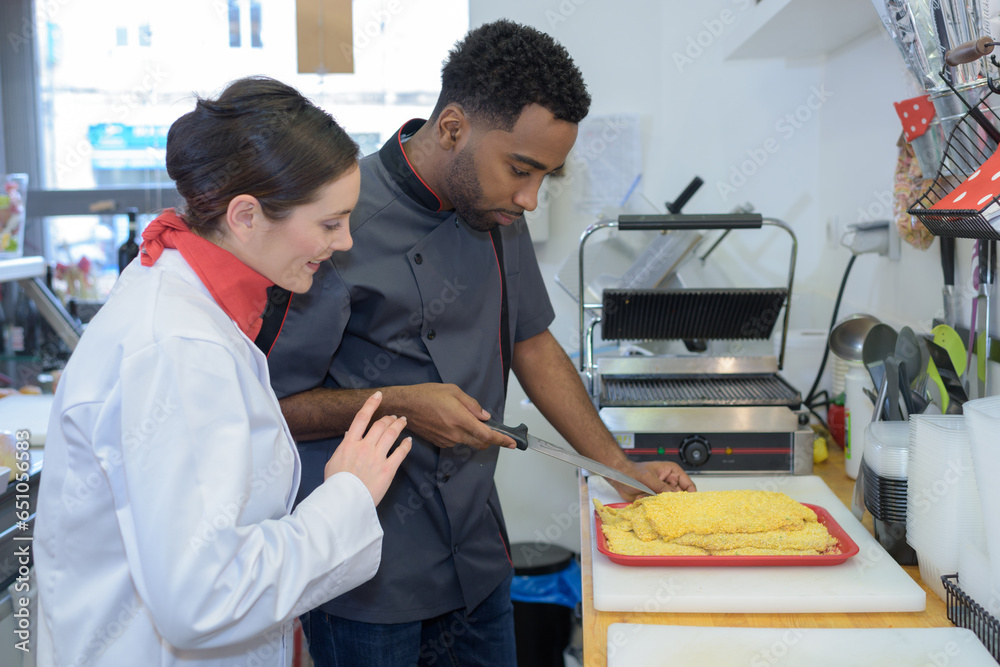 Obraz premium chef cutting parma raw ham