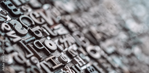 Letterpress background, close up of many old, random metal letters with copy space