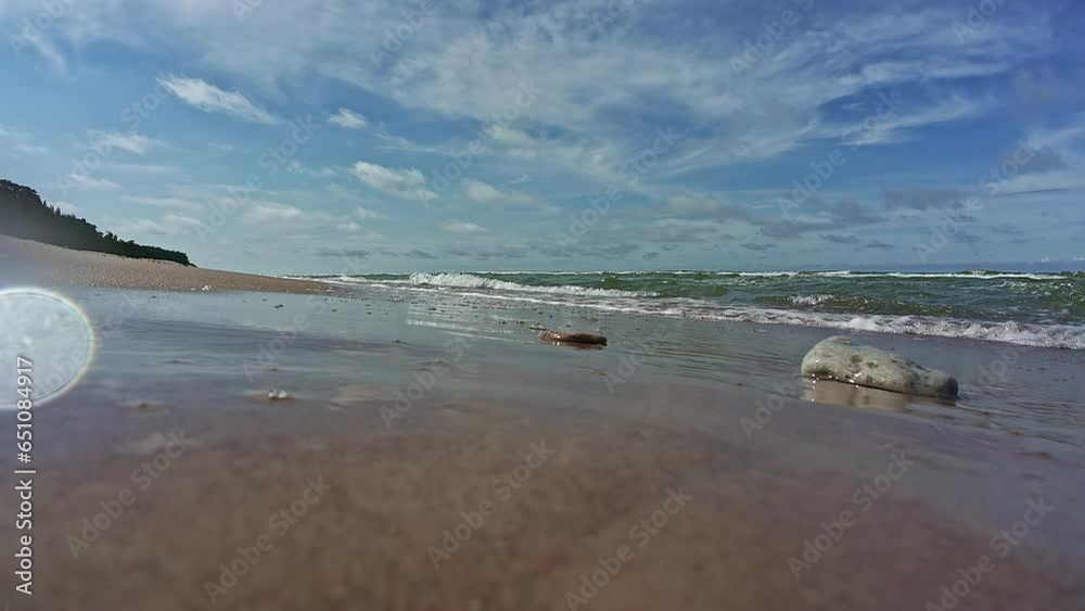 Splashing Waves On A Sandy Seacoast Of A Tropical Beach During Summer. Close Up, Slow Motion Splashing Waves On A Sandy Seacoast Of A Tropical Beach During Summer. Close Up, Slow Motion