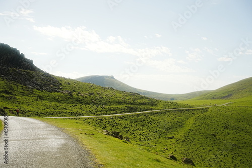 Stunning view of green mountains and trails at the foothills of the French Pyrenees, part of the Camino de Santiago. Perfect for nature, travel, and adventure projects.