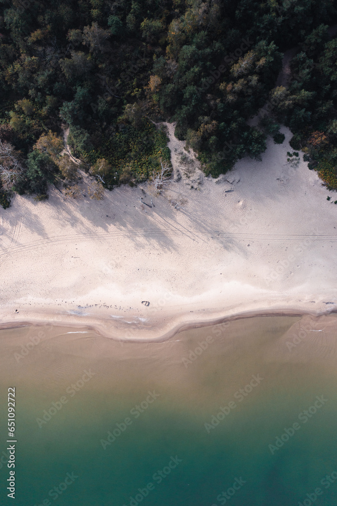 A lonley beach with white sand 