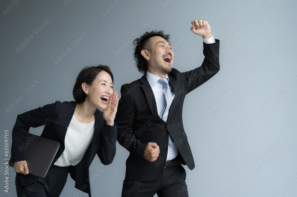For changing jobs and hiring. Speedy image of a gut-punching businessman and a cheering woman. For changing jobs and hiring. Speedy image of a gut-punching businessman and a cheering woman.