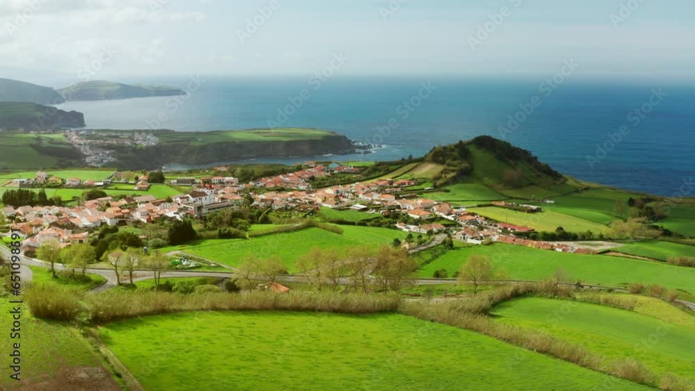 Cinematic aerial drone shot Sao Miguel island in the Azores - Portugal.
High view of picturesque green landscape, turquoise water and long coastline. Turistic attraction. Cinematic aerial drone shot Sao Miguel island in the Azores - Portugal.
High view of picturesque green landscape, turquoise water and long coastline. Turistic attraction.