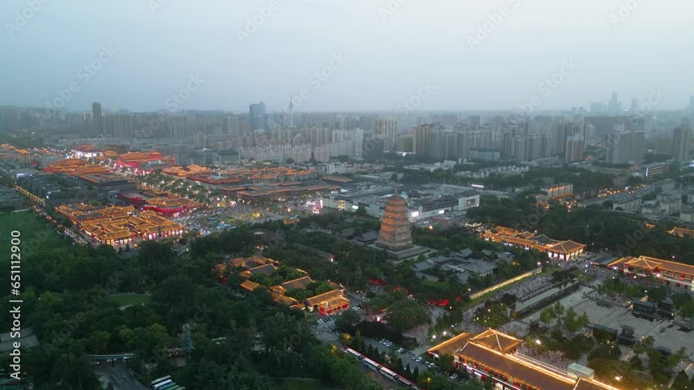 Distancing and ascending aerial over Datang Everbright. It is pedestrian mall that is located at the foot of the Giant Wild Goose Pagoda in Xi'an, city of northwest China's Shaanxi Province. Distancing and ascending aerial over Datang Everbright. It is pedestrian mall that is located at the foot of the Giant Wild Goose Pagoda in Xi'an, city of northwest China's Shaanxi Province.