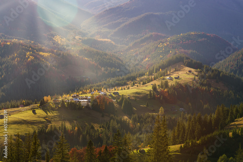 Majestic panorama of autumn mountains morning lighting with sun rays. Nature of Ukraine.