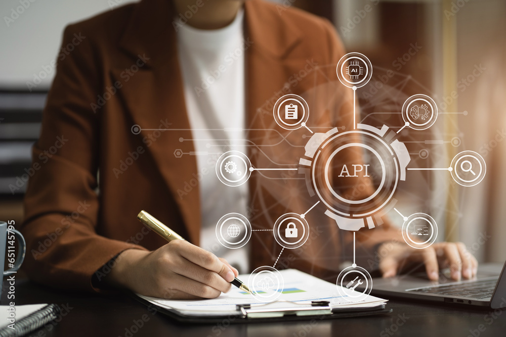 Modern technology and networking concept, woman using laptop, tablet and smartphone with virtual screen API icon Software development tool. API Application Programming Interface.