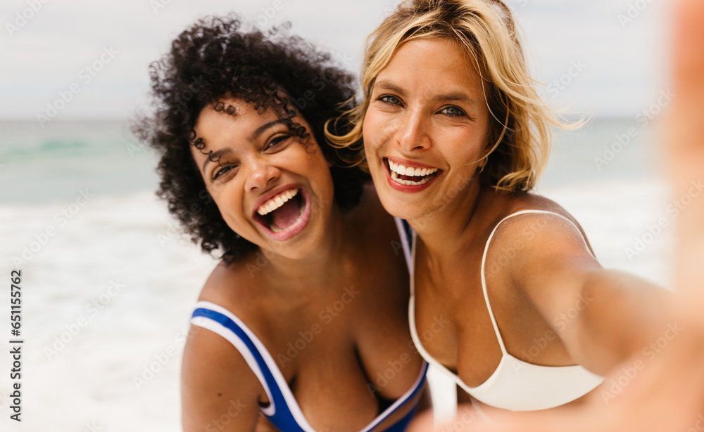 Beach selfie vibes: Friends capturing laughter, fun, and authentic moments by the ocean