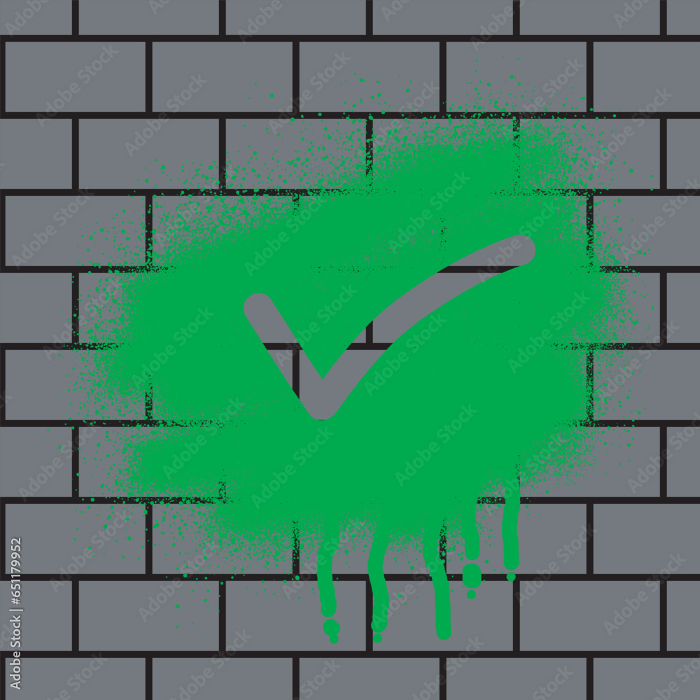 Check mark graffiti with black spray paint on brick wall background