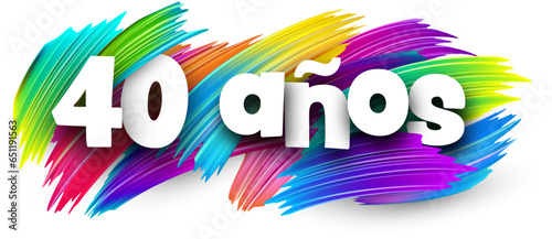 40 years at spanish paper word sign with colorful spectrum paint brush strokes over white.