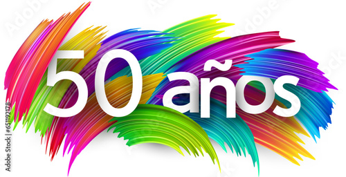 40 years at spanish paper word sign with colorful spectrum paint brush strokes over white.