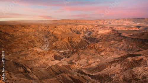 Panoramic view of Fish River Canyon in Southern Namibia  with impressive size and stunning geological formations. Captured at sunrise.