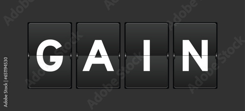 Black color analog flip board with word gain on gray background