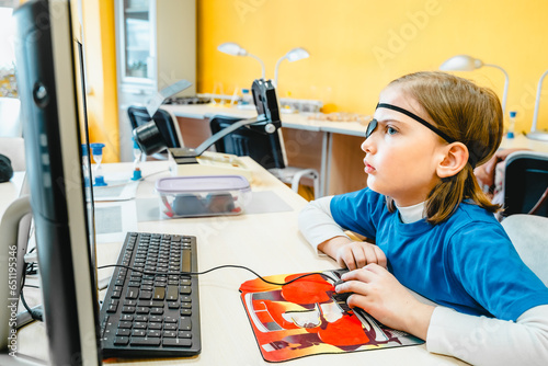 Little girl in medical office undergoing advanced laser vision treatment, correction for eyes health. Pediatric ophthalmology procedure. Visual acuity, strabismus improvement. Advanced technology