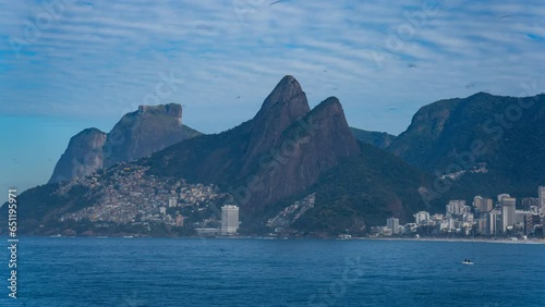 Stunning Timelapse of Dos Hermanos Rocks Rising Above Rio de Janeiro's Favelas photo