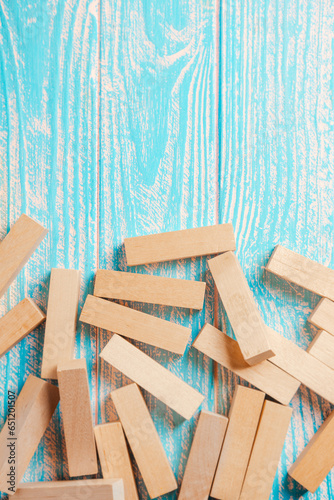 Jengo cubes are scattered on the board. Place for your text.