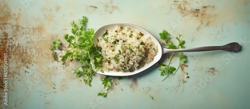 Fork holding rice parsley and mushrooms isolated pastel background Copy space photo