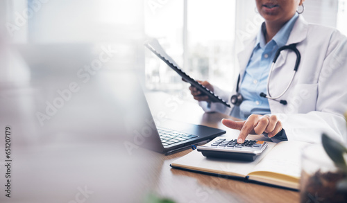 Accounting doctor, calculator and hands of person calculating bookkeeping finance, hospital budget or medical savings. Mockup space, healthcare and accountant working on taxes, audit or compliance photo