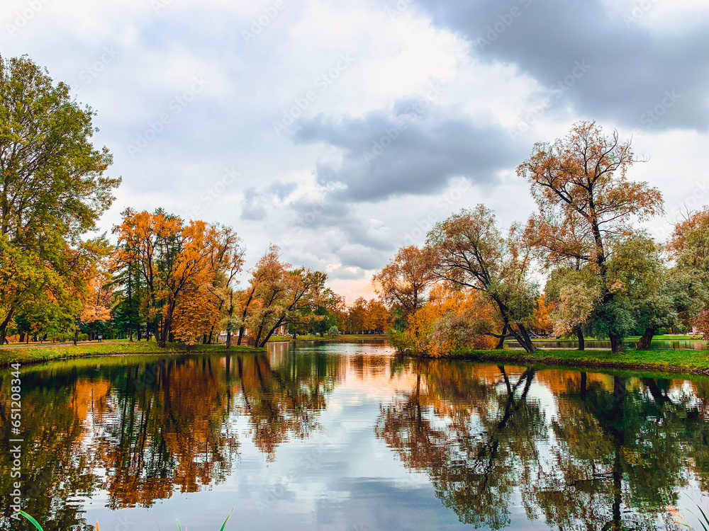 Autumn landscape. Beautiful lake and colorful trees.