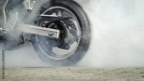 Motorbike burnout, Biker on a motorcycle drifts in smoke, burns tire on a motorcycle.
