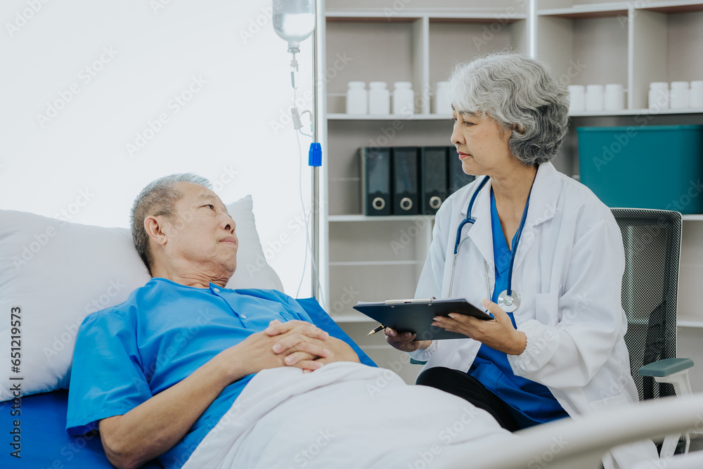 Asian female doctor caring for elderly male patient Elderly patient care and health lifestyle, medical concept Asian female doctor caring for elderly male patient Elderly patient care and health lifestyle, medical concept