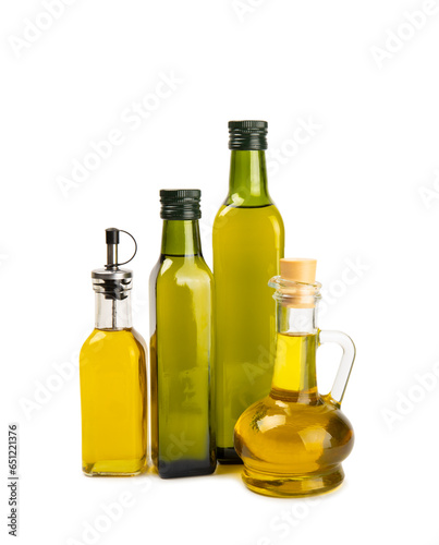 Olive oil in a bottle isolated on white background. Oil bottle with branches and fruits of olives. Place for text. copy space. cooking oil and salad dressing.