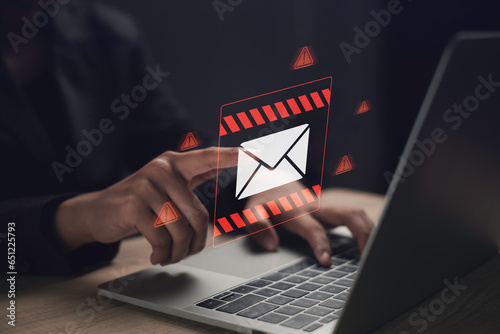 New email spam notification alert with warning caution. Cyber security on internet letter security protect, junk and trash mail and compromised information. photo