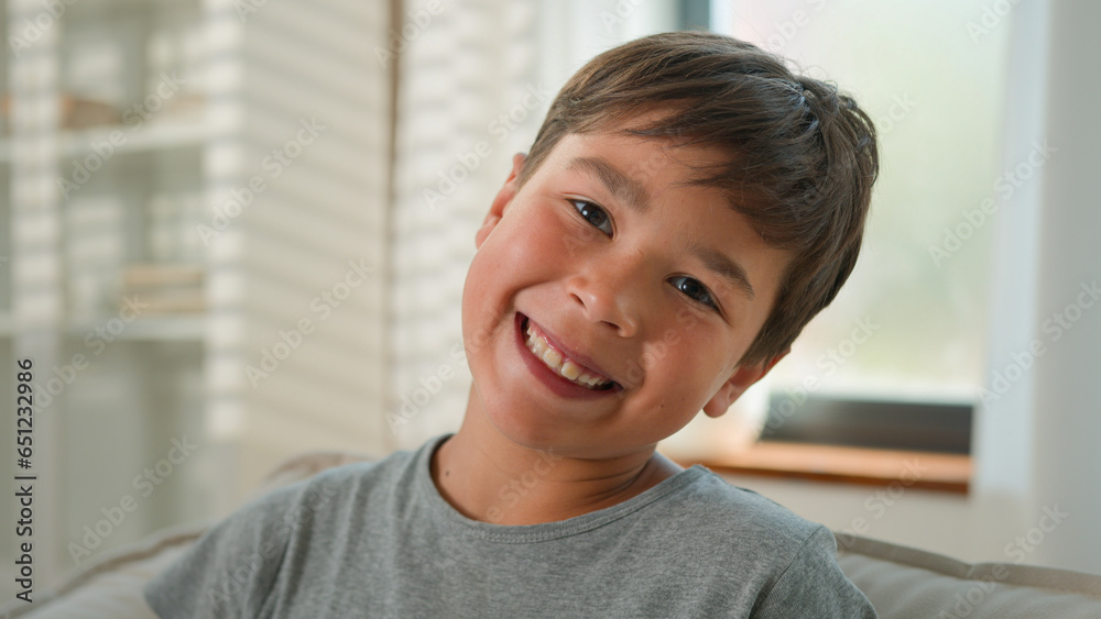 Close up child portrait happy funny little boy Caucasian male kid school preteen pupil schoolboy positive smiling baby teeth offspring carefree children family childcare laugh look at camera at home