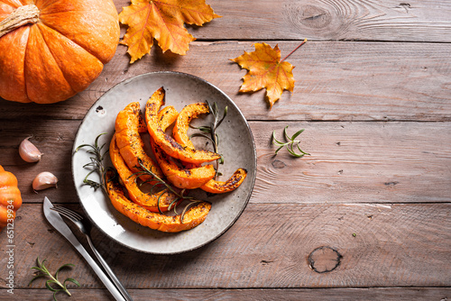 Grilled pumpkin slices with garlic and herbs