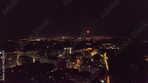 Wallpaper Mural Montpellier by night with a red moon aerial  Torontodigital.ca