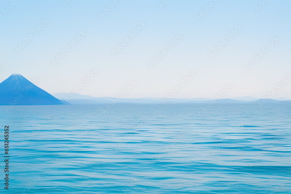 Beautiful seascape with a mountain and a clear sky in the distance 