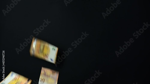 Slow flow towards euro banknotes currency movement background, money flying endless flow on black background.