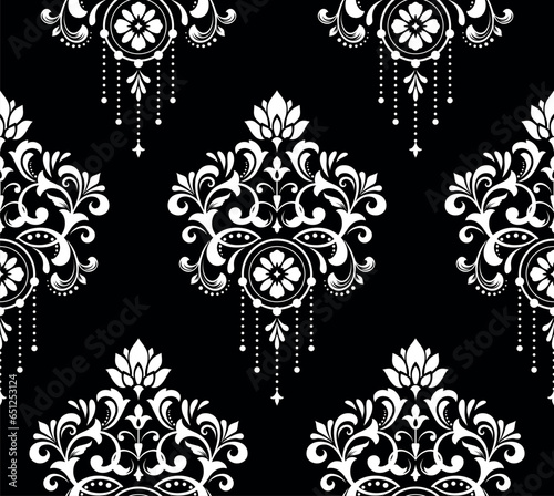 Wallpaper in the style of Baroque. Seamless vector background. White and black floral ornament. Graphic pattern for fabric, wallpaper, packaging. Ornate Damask flower ornament