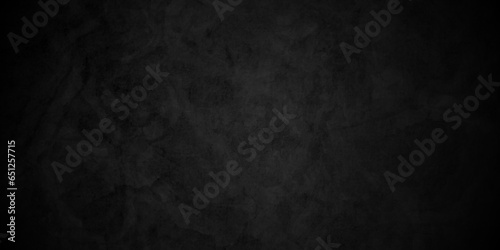 Dark black concrete vintage  stone wall grunge backdrop texture background. monochrome slate grunge concrete wall black backdrop vintage marbled textured border background. 