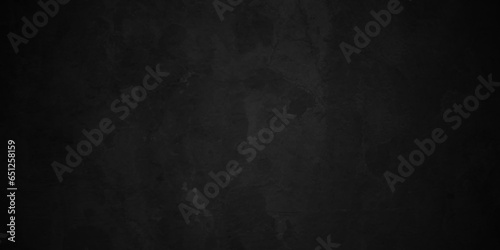 Dark black concrete vintage stone wall grunge backdrop texture background. monochrome slate grunge concrete wall black backdrop vintage marbled textured border background. © armans