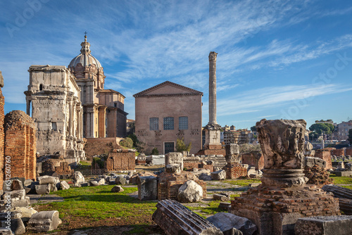 Roman ruins with Curia, Rostra and Triumphal Arch of Septimius Severus on the Roman Forum in Rome, Italy photo