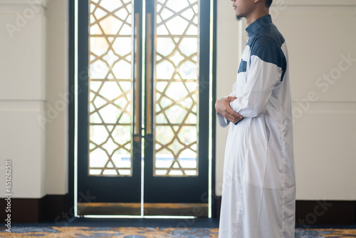 Asian muslim man solat and takbir take his hands up. Islam praying
