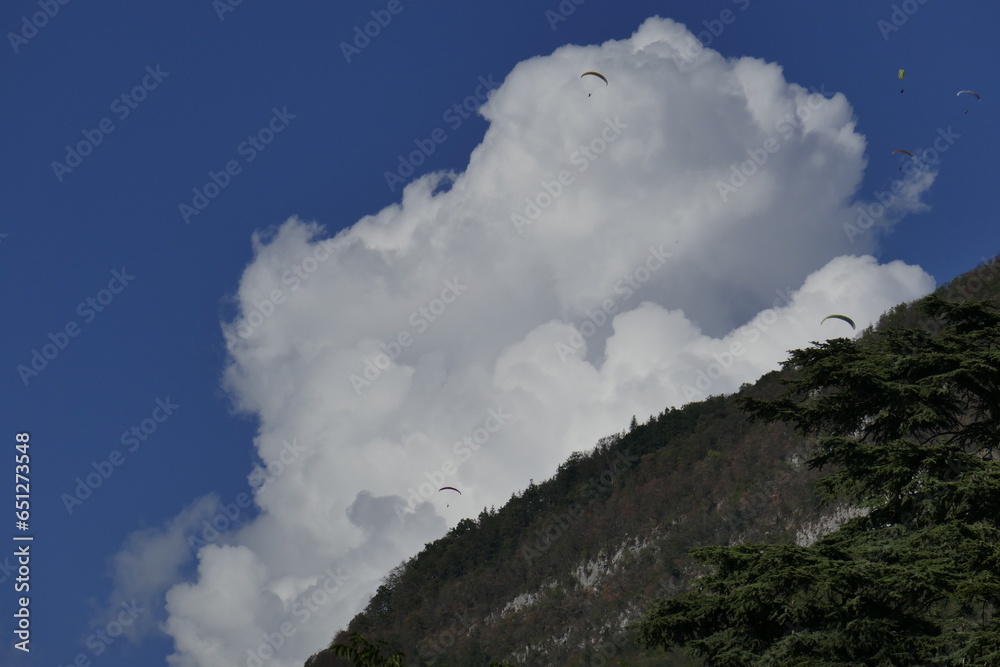 Clouds over white mountain by lake Annecy Clouds over white mountain by lake Annecy
