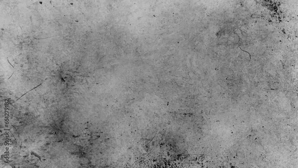 Black floating stains and particles on grey cement wall copy space of textures with dark dust and flickering stains. Chaotic movement of strokes with flickering, light leaks, dirt, grain	
