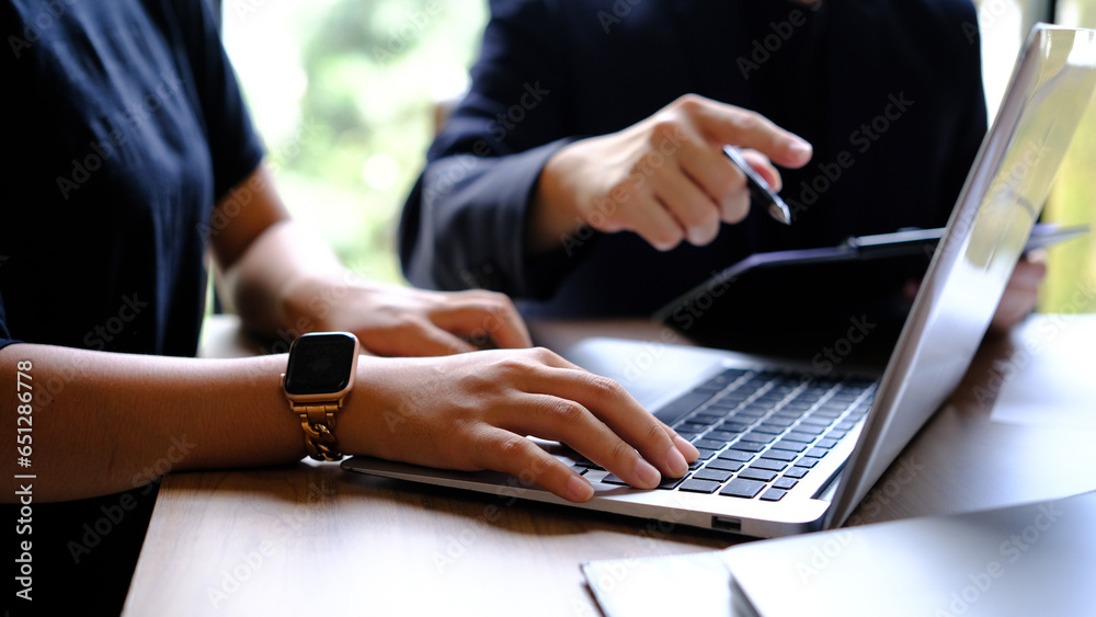 Meeting of business consultants analyzing financial charts and market growth charts to plan investment projects. Meeting of business consultants analyzing financial charts and market growth charts to plan investment projects.