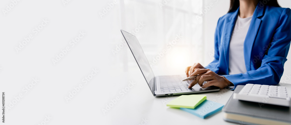 Portrait of woman working in finance using tablet computer and calculator in modern office Prepare account analysis reports Real estate investment information Financial and tax system concepts - obrazy, fototapety, plakaty 
