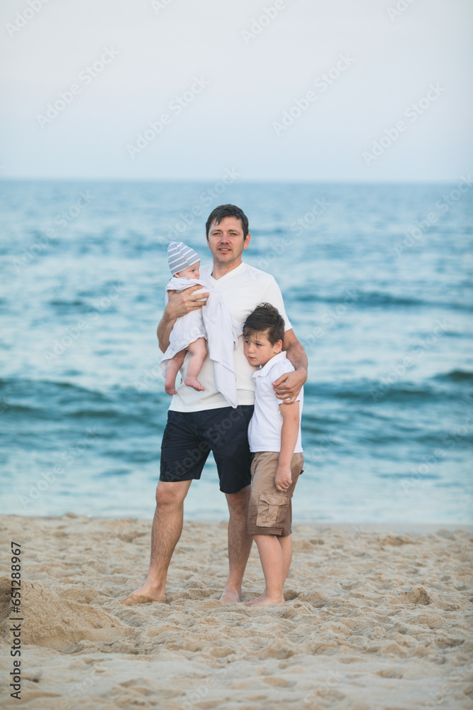 Father and child playing on tropical beach at sunset. Family summer vacation at sea resort. Dad playing with kids on sunny evening at ocean shore. Travel with children. Parent love Father and child playing on tropical beach at sunset. Family summer vacation at sea resort. Dad playing with kids on sunny evening at ocean shore. Travel with children. Parent love
