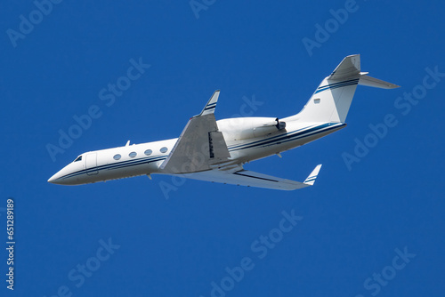 Untitled business jet passenger plane at airport. Corporate flight travel. Aviation and aircraft. Vip transport. Company and corporation transportation. Fly and flying.