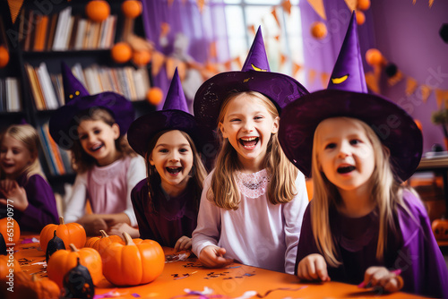 Happy kids celebrating Halloween in a classroom