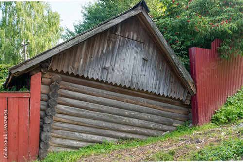 Yuryevets, Russia, July 5, 2023. Picturesque old log barn. photo