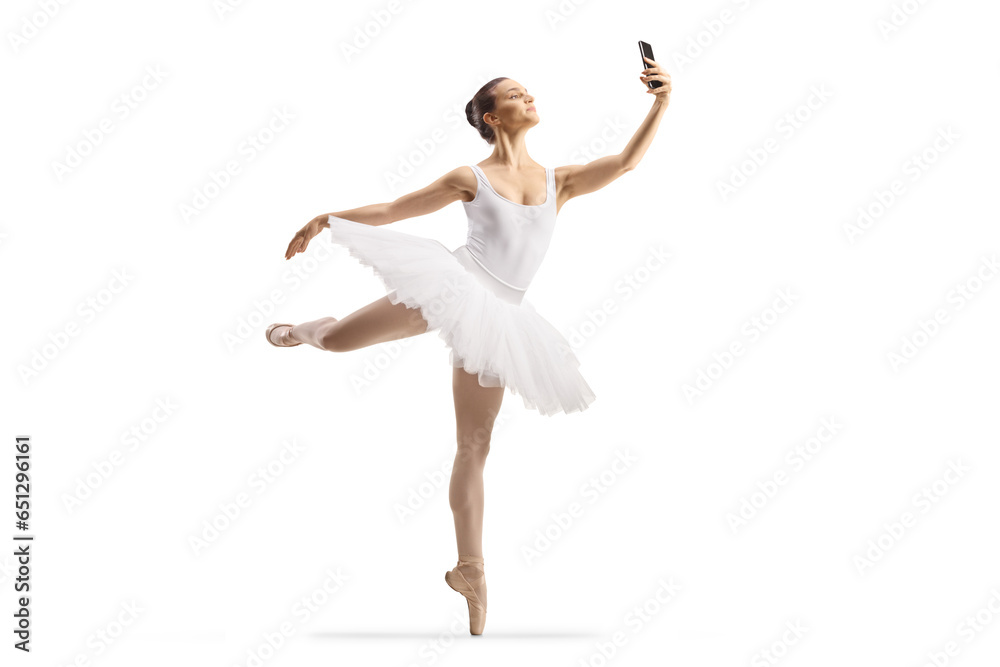 Full length shot of a ballerina dancing and using a smartphone Full length shot of a ballerina dancing and using a smartphone