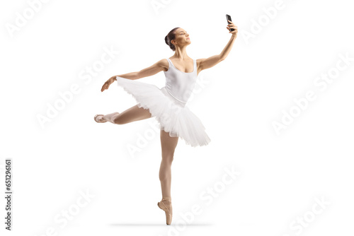 Full length shot of a ballerina dancing and using a smartphone