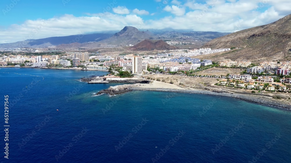 Drone view of many hotels at the beach on the Canary Island of Tenerife - obrazy, fototapety, plakaty 