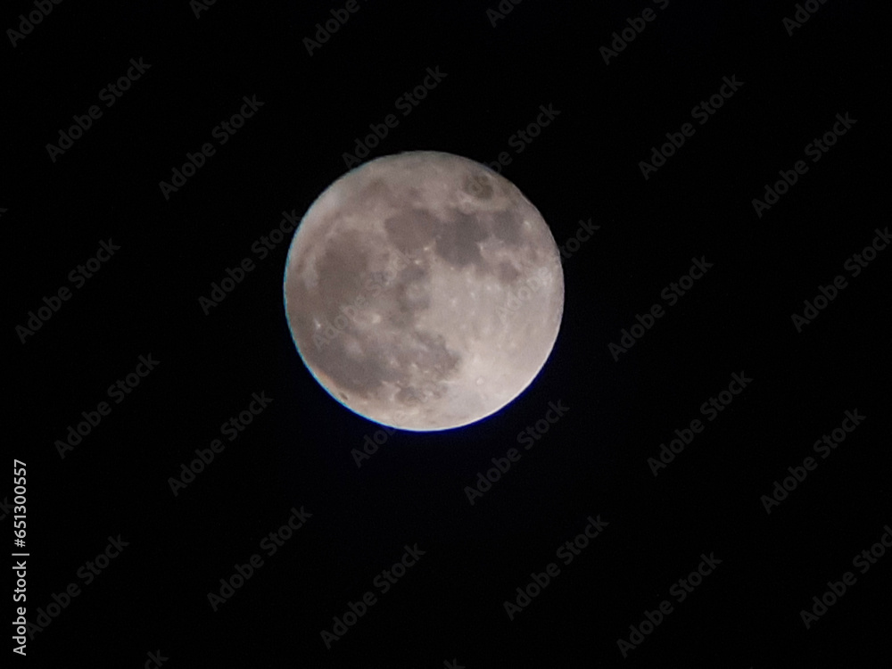 Super full blue moon in Indonesia shot on september 2023, isolated on dark background Super full blue moon in Indonesia shot on september 2023, isolated on dark background