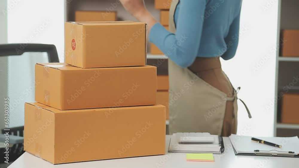 Business woman start up small business entrepreneur SME success .freelance woman working at home with Online Parcel delivery. SME and packaging deliveryconcept Business woman start up small business entrepreneur SME success .freelance woman working at home with Online Parcel delivery. SME and packaging deliveryconcept